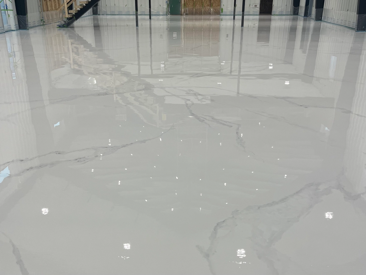 Warehouse floor featuring a white and grey metallic marble epoxy design