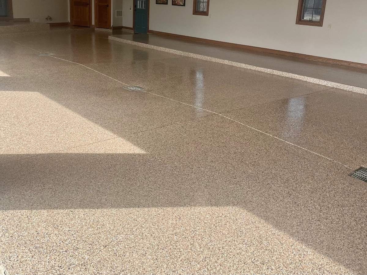 Commercial building area finished with a custom flake epoxy design