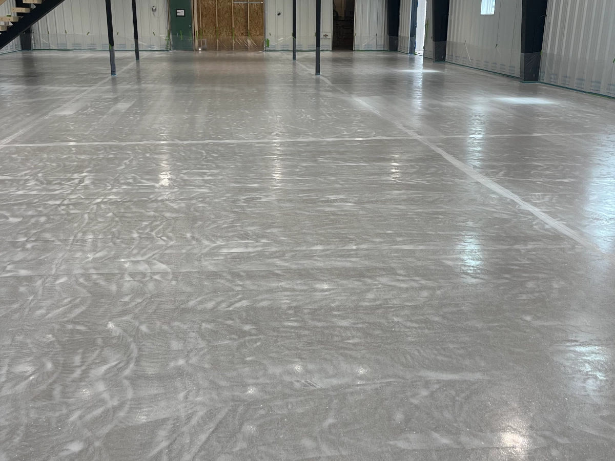 Empty warehouse with a grey unfinished coat on the floor