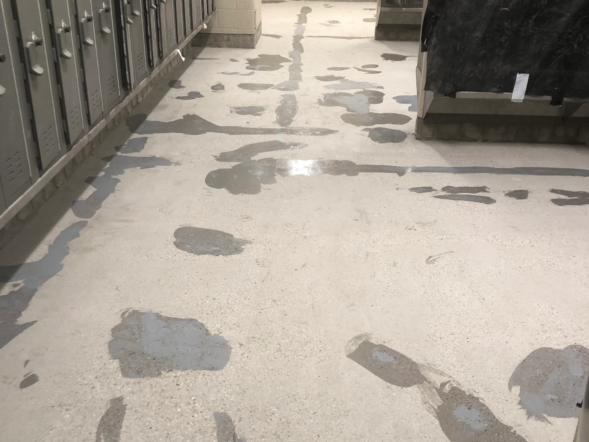 Commercial interior lockeroom with prepped concrete floor by Rhino Epoxy
