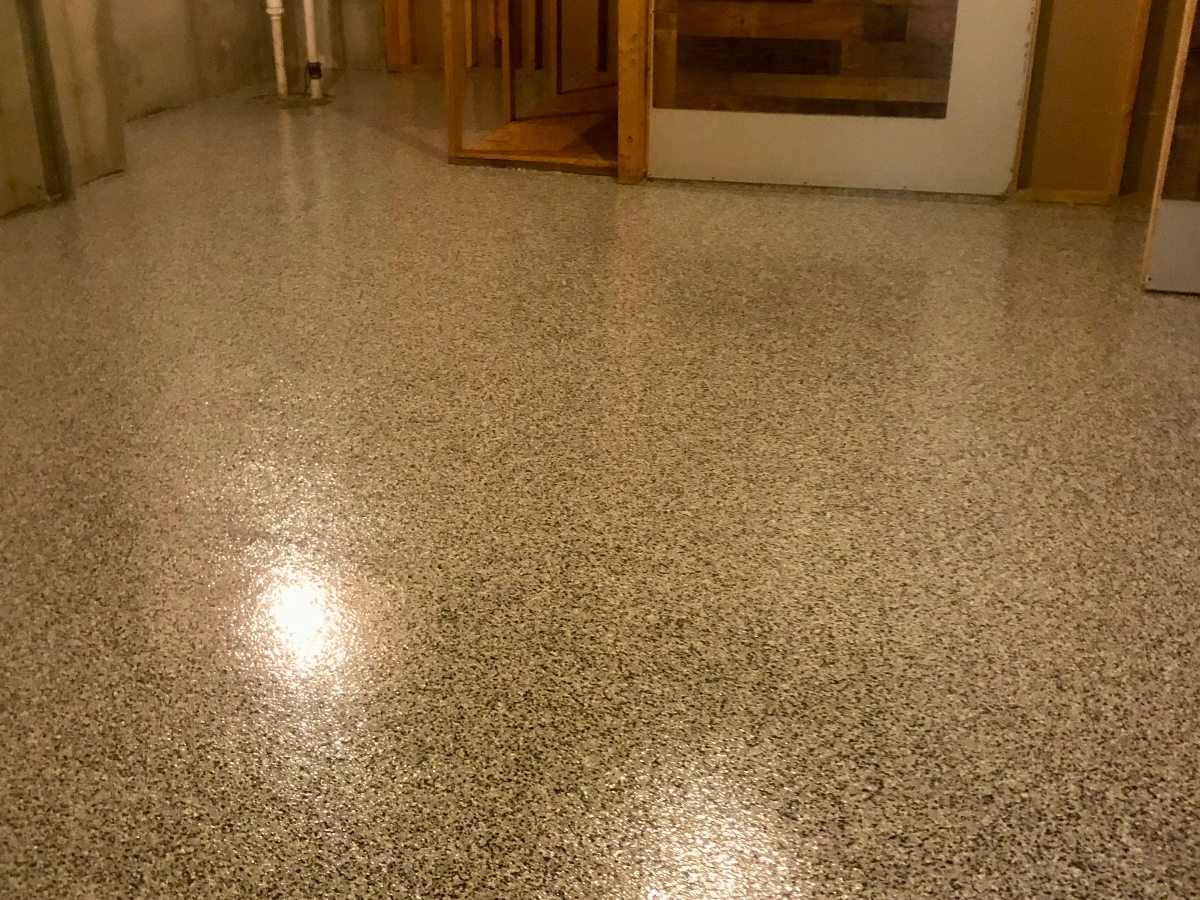 Basement area finished with a new epoxy flake floor