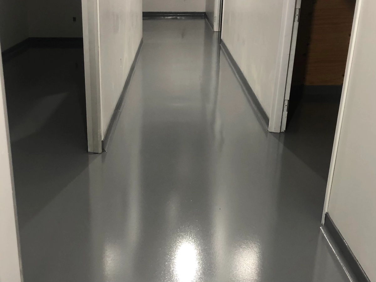 Alleyway and side rooms finished with a solid grey epoxy floor