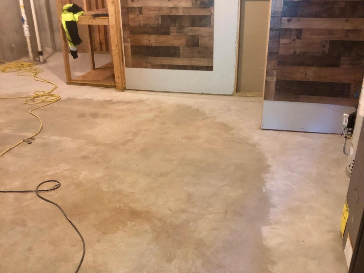 Basement area with bare concrete before coating